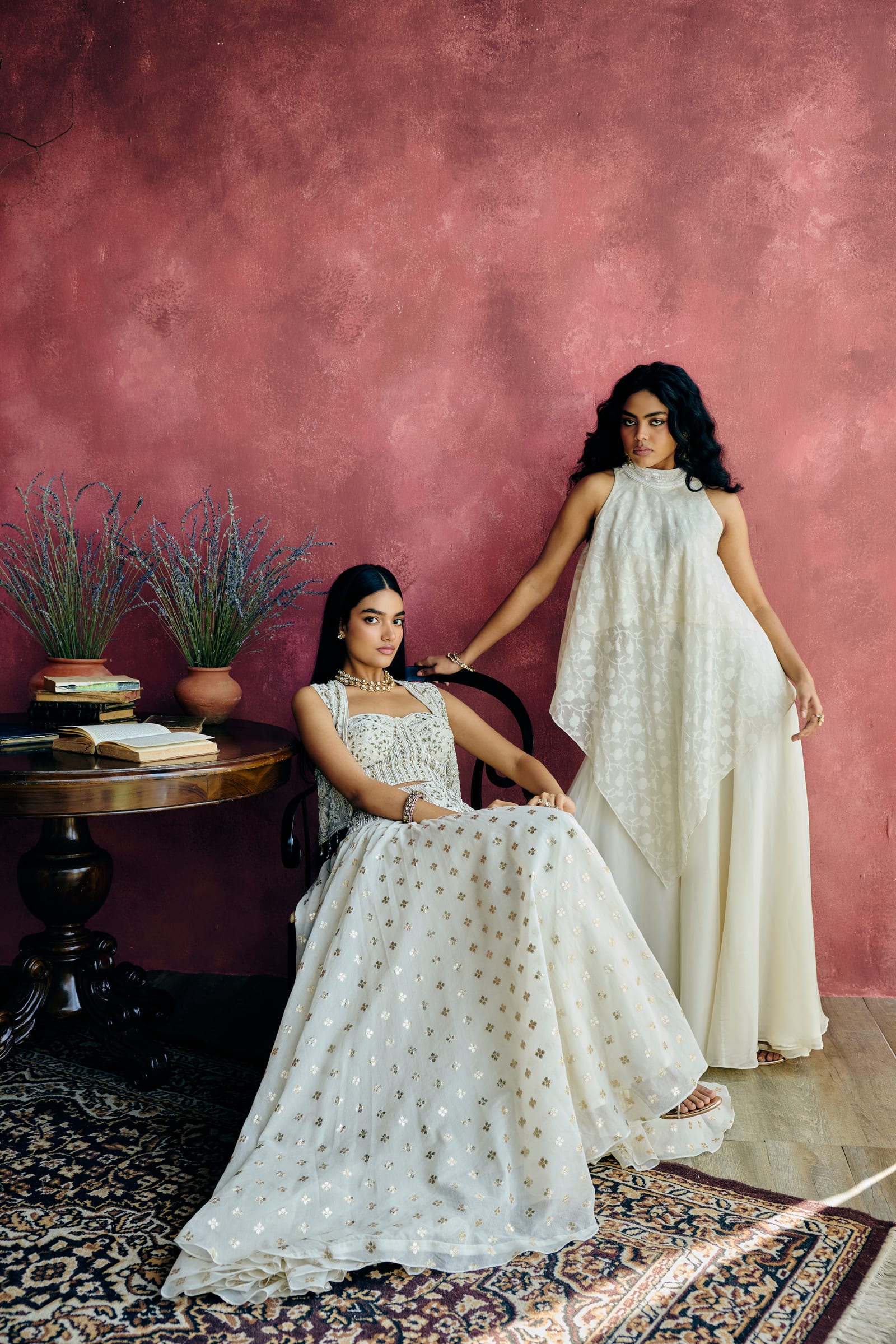 A woman in a designer lehenga blouse with a statement back