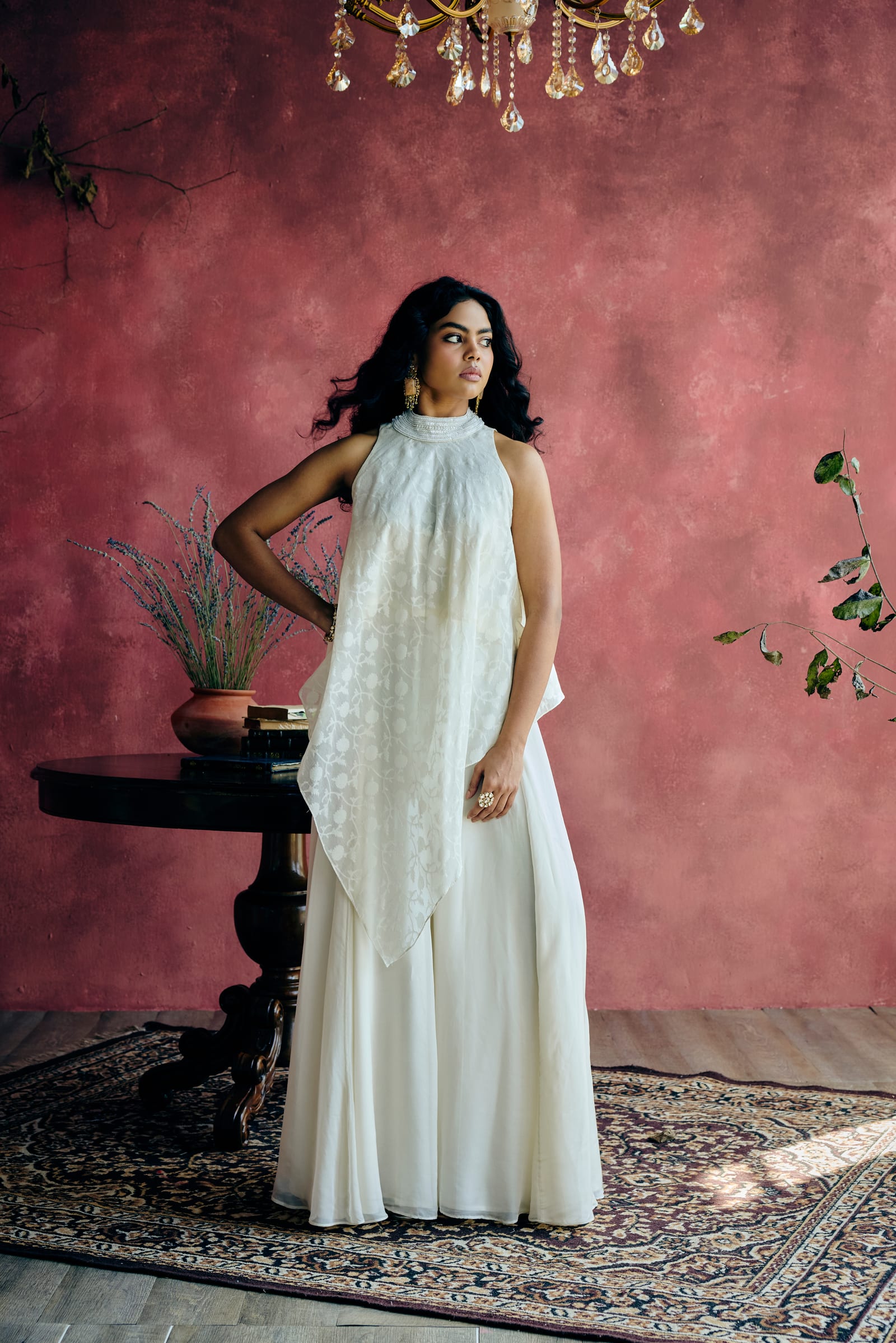 A woman showing an elegant lehenga dupatta drape